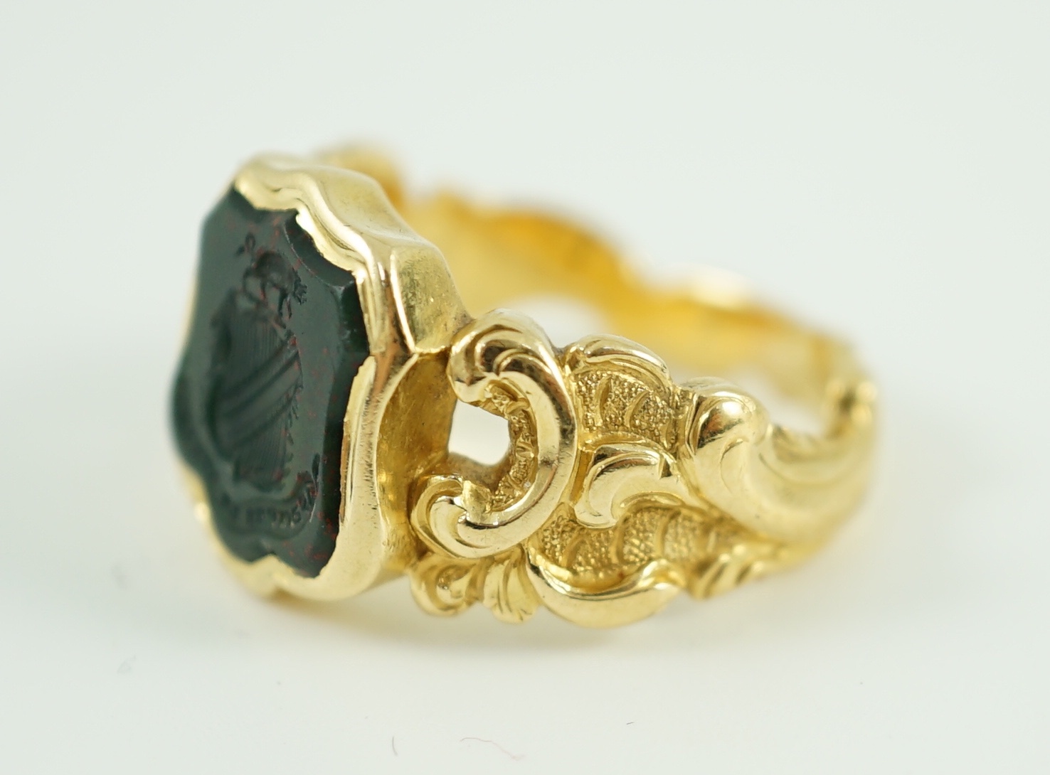 A 19th century gold and bloodstone set intaglio ring